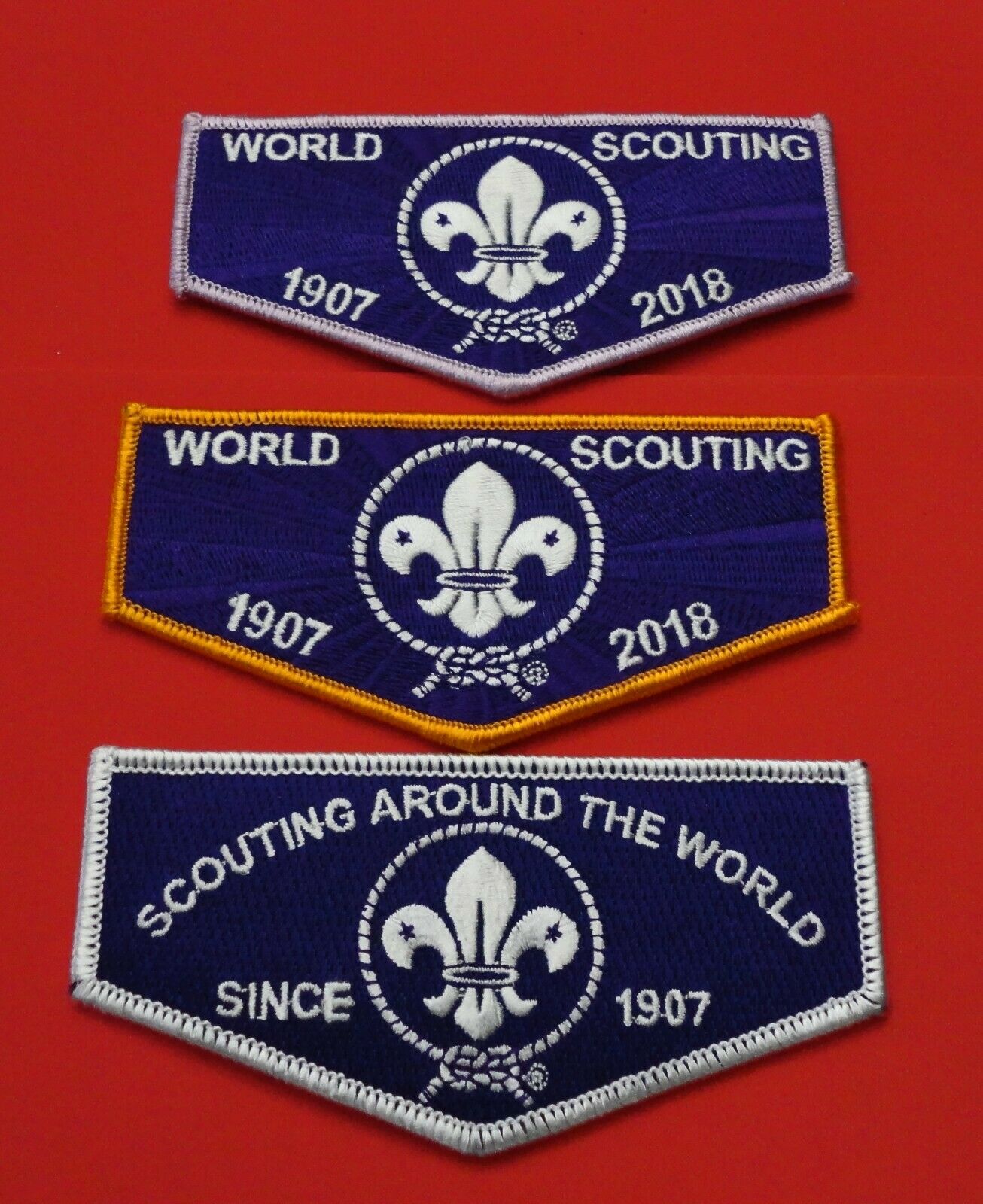 Three World Scouting Flaps: White, Orange & Lavender Borders